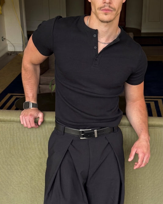 AURRA Henley in Black — ribbed cotton, three-button placket