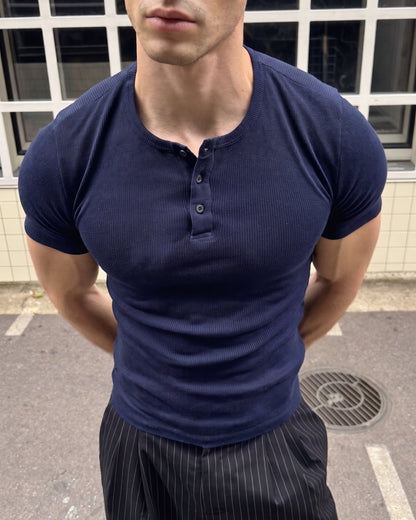 AURRA Henley in Navy — close detail of the ribbed knit and placket
